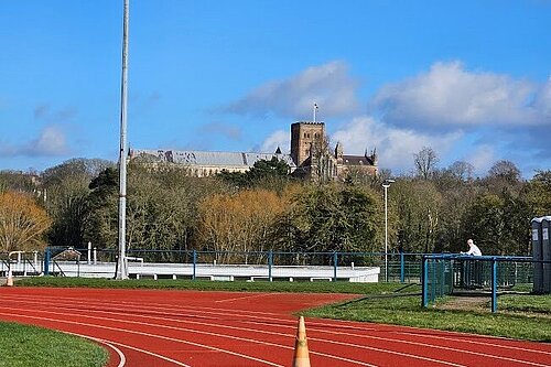 Photograph of Abbey View Athletics Track with the Cathedral in the background 