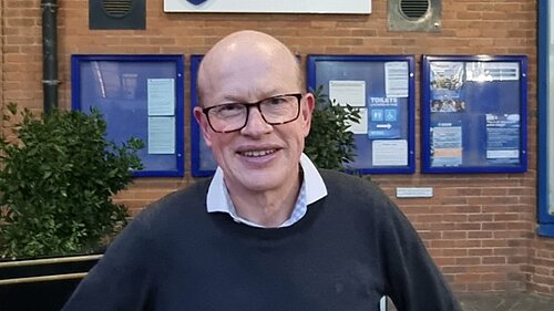 Councillor Paul de Kort is pictured standing in front of the St Albans district council building.
